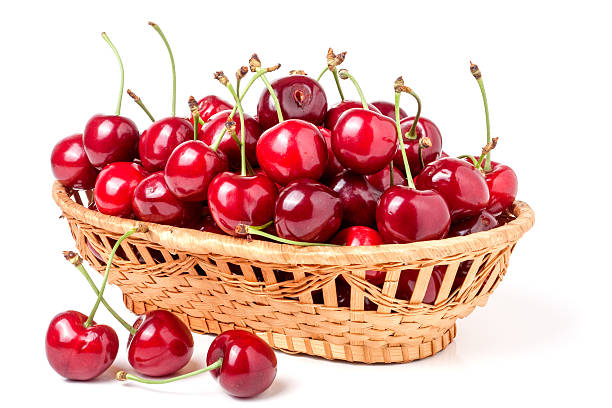 istock cherries in a wicker basket isolated on white background 538489030