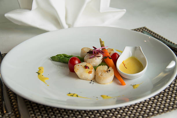 istock gourmet seared scallops with garnishes. 538490206