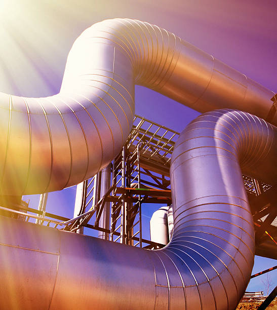 istock Industrial zone, Steel pipelines at sunset 538490592