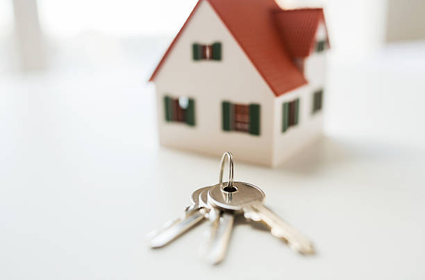istock close up of home model and house keys 538490864