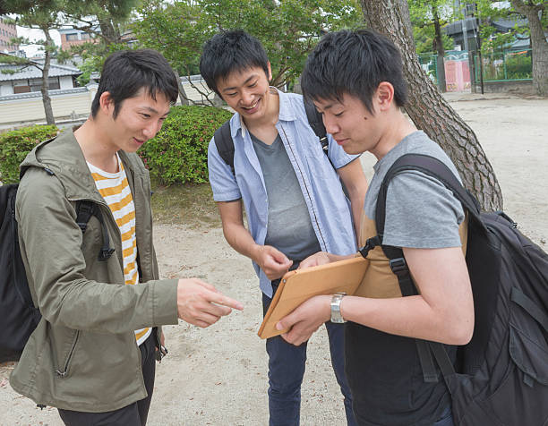 istock japanese students together with classmate checking notepad in kyoto japan 538492320