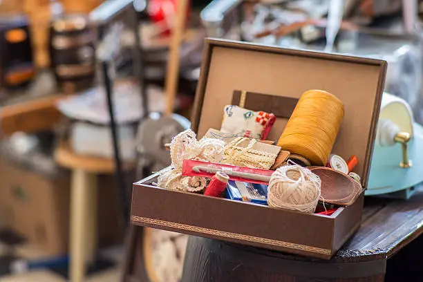 A old sewing kit in a second hand store.