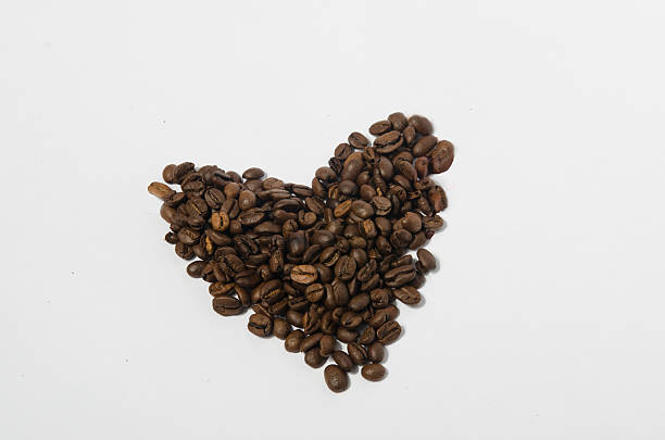 Coffee beans in heart shape stock photo