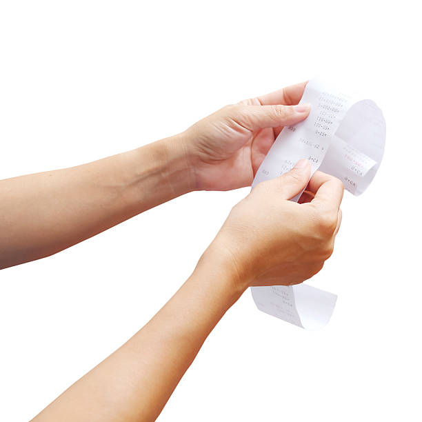 istock hand of woman checking a long  receipt 538504277