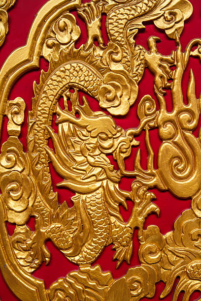istock Golden dragon decorated on red wood wall 538504419