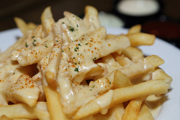 istock french fries with melted cheese 538505911