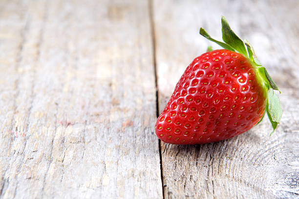 istock Strawberry on wood 538511469