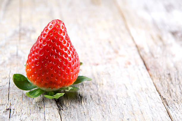 istock Strawberry on wood 538511473