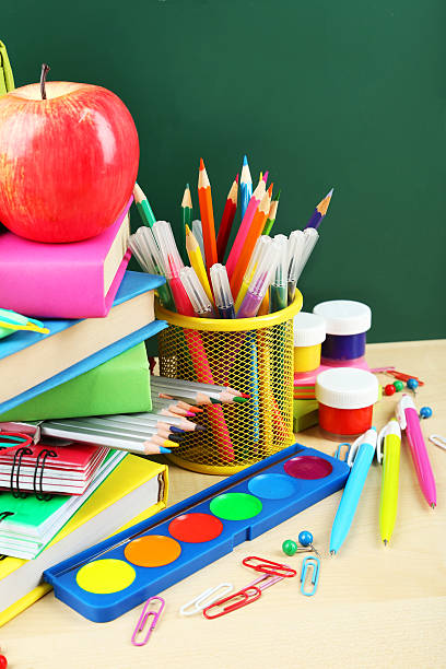 istock Back to school supplies. Books and blackboard. 538512033