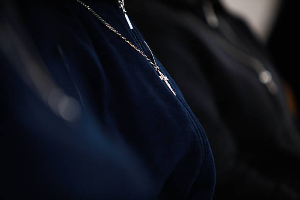 Nun with cross Nun with cross during prayer in monastery, Christmas and Easter symbology nun catholicism sister praying stock pictures, royalty-free photos & images