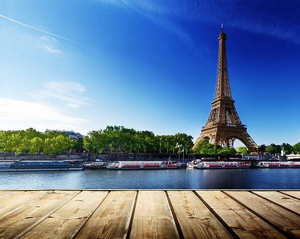 istock background with wooden deck table and  Eiffel tower in Paris 538532557