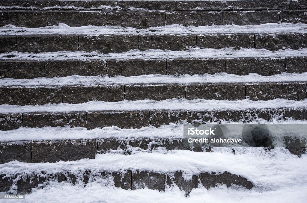 Snow on a retaining wall Snow lines the step backs of an interlocking retaining wall 2015 Stock Photo