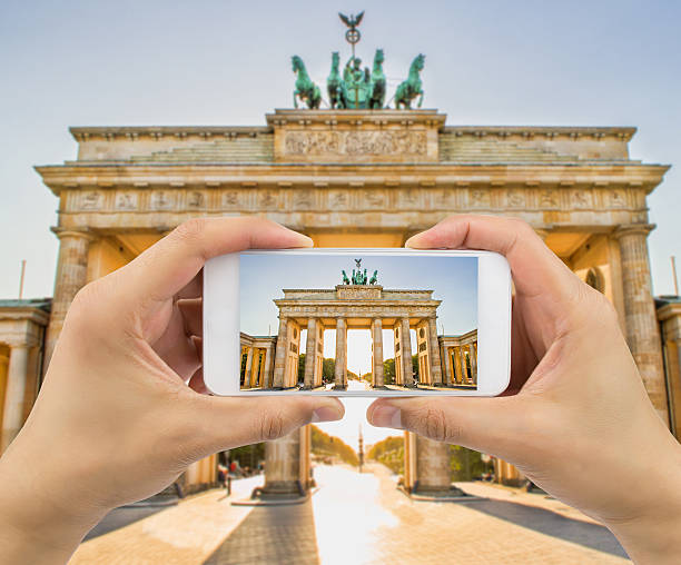 istock taking a picture a brandenburg gate 538561154