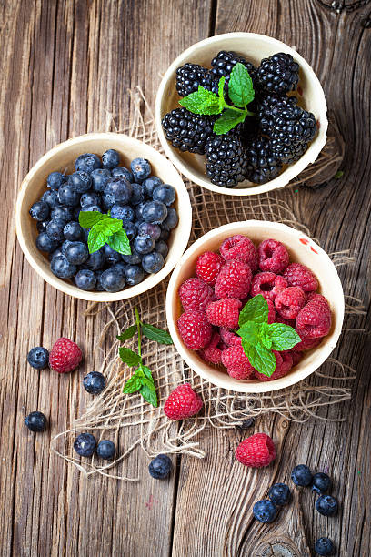 istock Blackberries, raspberries and blueberries in a waffle bowls. 538561494