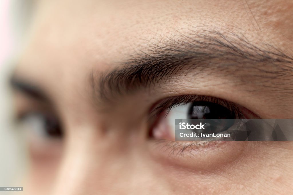 Men's Eyes a man looking at something Eye Stock Photo