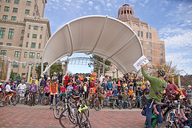 Asheville, North Carolina, USA - November 8, 2014:  Bicyclists dressed in Halloween costmes get ready to ride their bicycles in the annual Pumpkin Pedaler event on November 8, 2014 in downtown Asheville's Pack Square