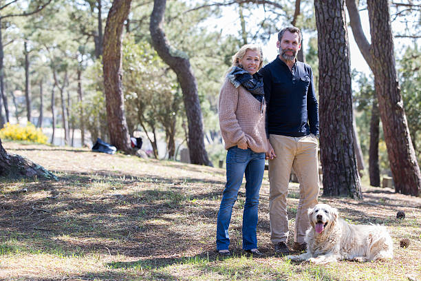istock Middle aged couple walking near sea side 538562274