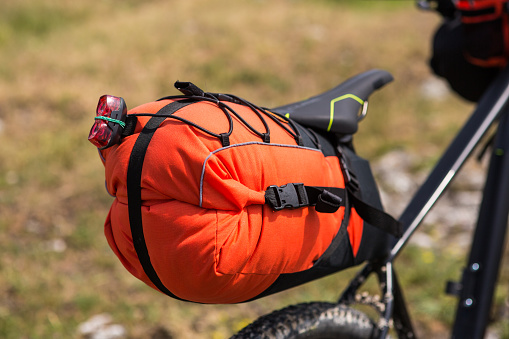 Mountain Bicycle outdoor with orange bags for travel