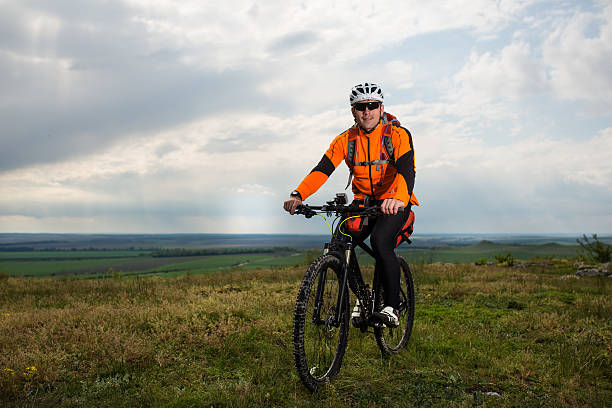 istock Young man is riding bicycle outside. Healthy Lifestyle. 538564796