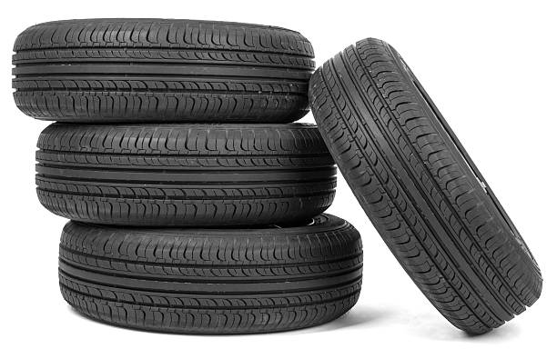 istock Stack of four wheel new black tyres 538565426