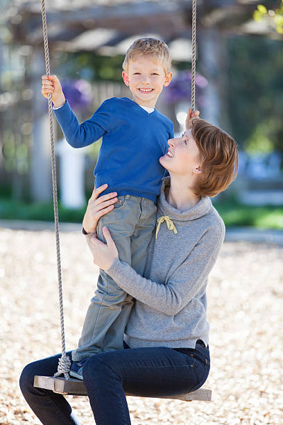 istock family at swings 538566035