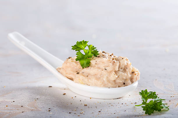 Creamy fish pate in spoon stock photo