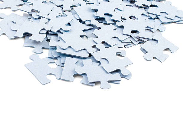 istock Pile of grey blank puzzle pieces 538567390