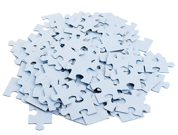istock Pile of grey blank puzzle pieces 538567454