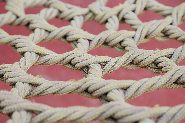 istock Unusual Yellow rope knotted in park 538568473