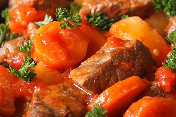istock stew in tomato sauce and vegetables macro horizontal. Background 538569307