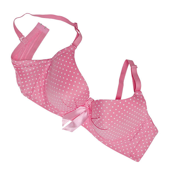 istock Pink polka dot bra isolated on white 538569566