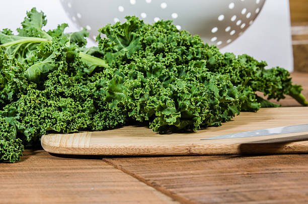 istock Green curly kale and knife 538569735