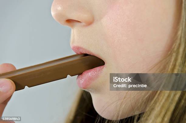 Girl Eats Chocolate Stock Photo - Download Image Now - 2015, Baby - Human Age, Baby Girls