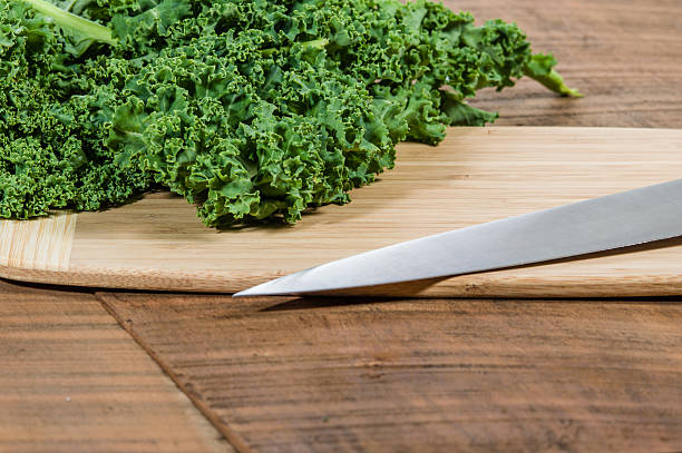 istock Green curly kale and knife 538570251