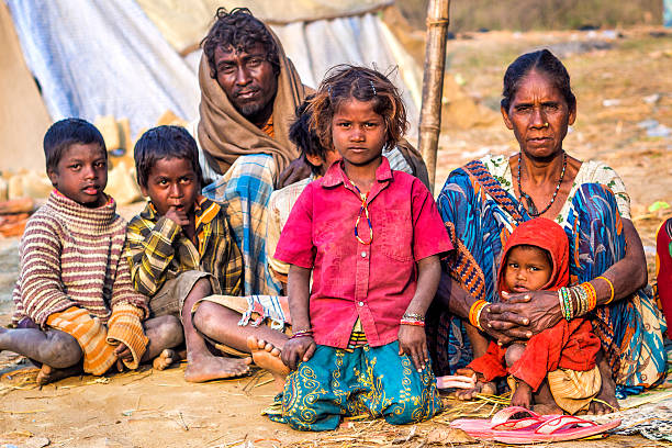 Poor Indian Family on the Street in Allahabad, India Allahabad, India - February 10, 2013: Poor Indian family in rural area near Allahabad, Uttar Pradesh, India. prayagraj photos stock pictures, royalty-free photos & images