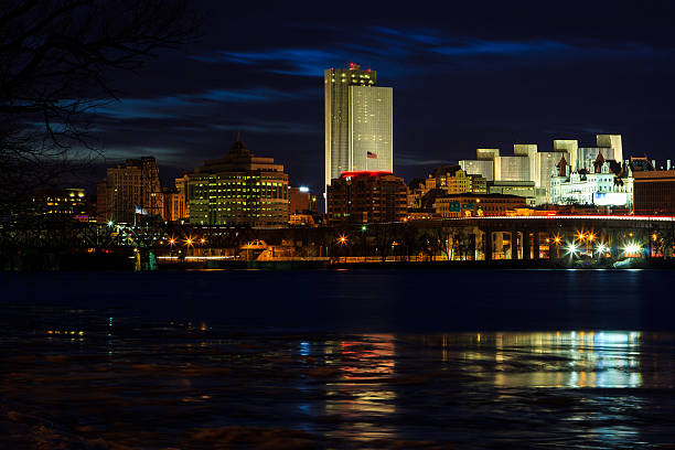istock Albany NY skyline at night reflections off the Hudson River 538572202
