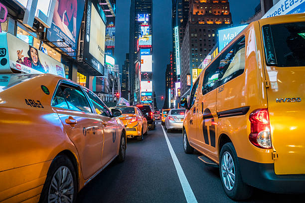 istock Times Square illuminated at night with yellow taxi cabs 538573186