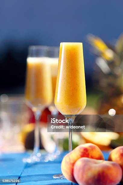 Italian Bellini Alcoholic Cocktail With Peach Stock Photo - Download Image Now - Backgrounds, Beach, Bellini