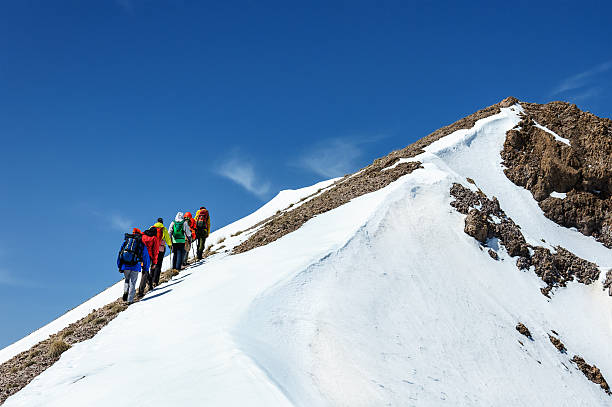 istock Group climbers goes down from the top of Erciyes volcano. 538575530