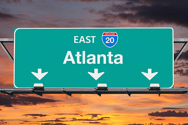 istock Atlanta Interstate 20 East Highway Sign with Sunrise Sky 538576280
