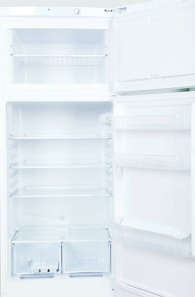 istock The open fridge with the shelves, close up 538576502