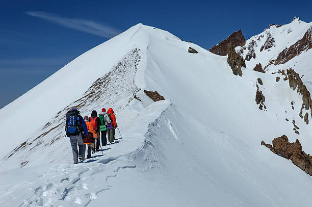 istock Group climbers goes down from the top of Erciyes volcano. 538577668