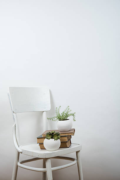 istock chair and empty wall background, interior art poster mock up 538578242