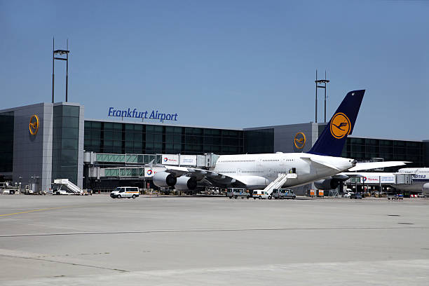 Airbus A380 parked air airport gate Frankfurt, Germany - June 07, 2016: An Airbus A380 from Lufthansa airline is being loaded and prepared for its next flight, parked at a stationary gate at Frankfurt Airport. frankfurt international airport stock pictures, royalty-free photos & images