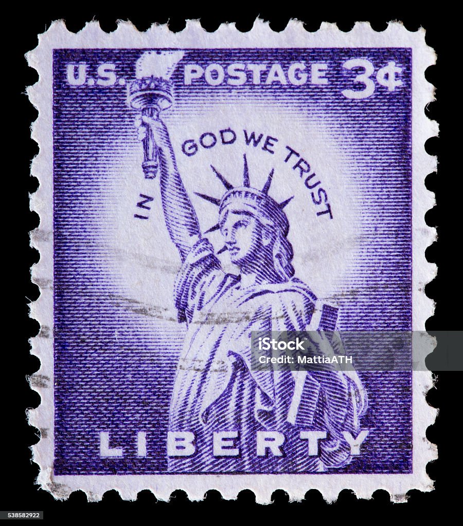 United States used postage stamp showing the Statue of Liberty UNITED STATES OF AMERICA - CIRCA 1954: A used postage stamp printed in United States shows the Statue of Liberty on a violet background, circa 1954 Postage Stamp Stock Photo