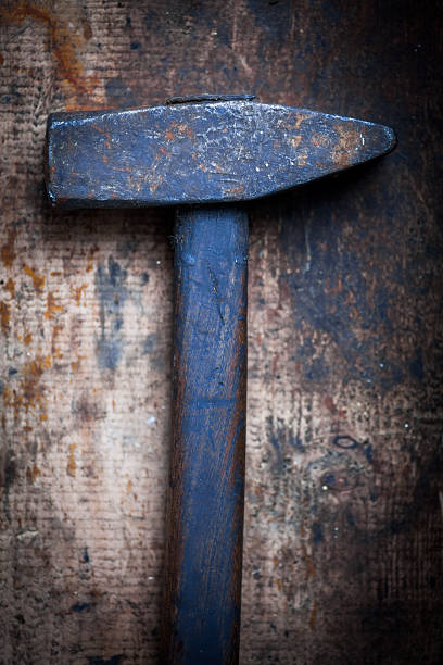 istock Hammer on wooden plank 538582930