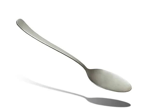 Metal soupspoon isolated on white background