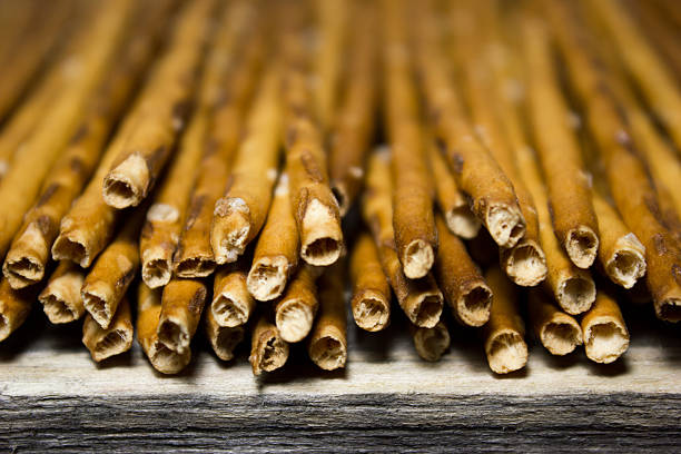 istock Bread sticks with salt on wooden background 538584980