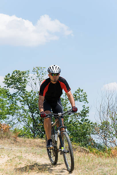 istock Mountain biker riding cross country 538585166