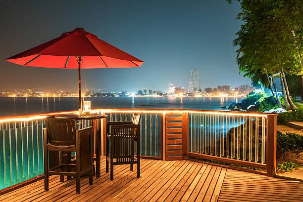 Open air cafe bar on the sea view terrace in night